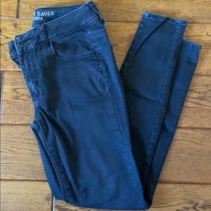 AE black washed super stretch jegging. Size 4